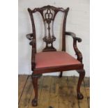 A set of ten Chippendale style carved mahogany dining chairs, including two with arms,