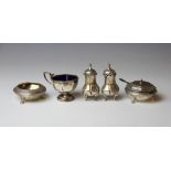 A pair of Victorian silver bun salts, Barnards, London 1875, with a matching spoon,