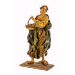 SCULTURA da presepe in terracotta e cartapesta raffigurante "donna con cesto di frutta". Sicilia XIX