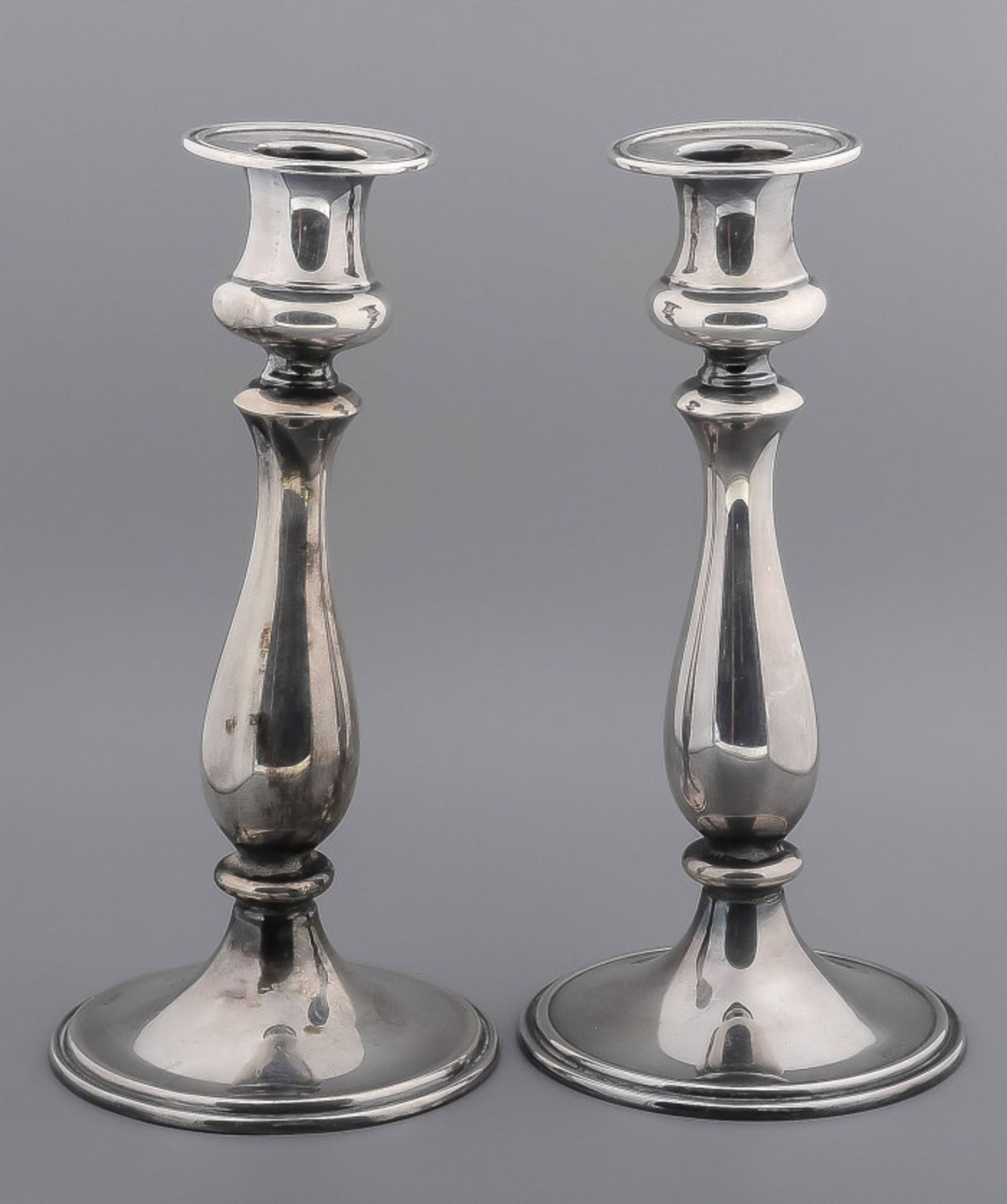 Set silver candlesticks with tight foot and balluster double fillet border, 925/000, 21xø10cm.