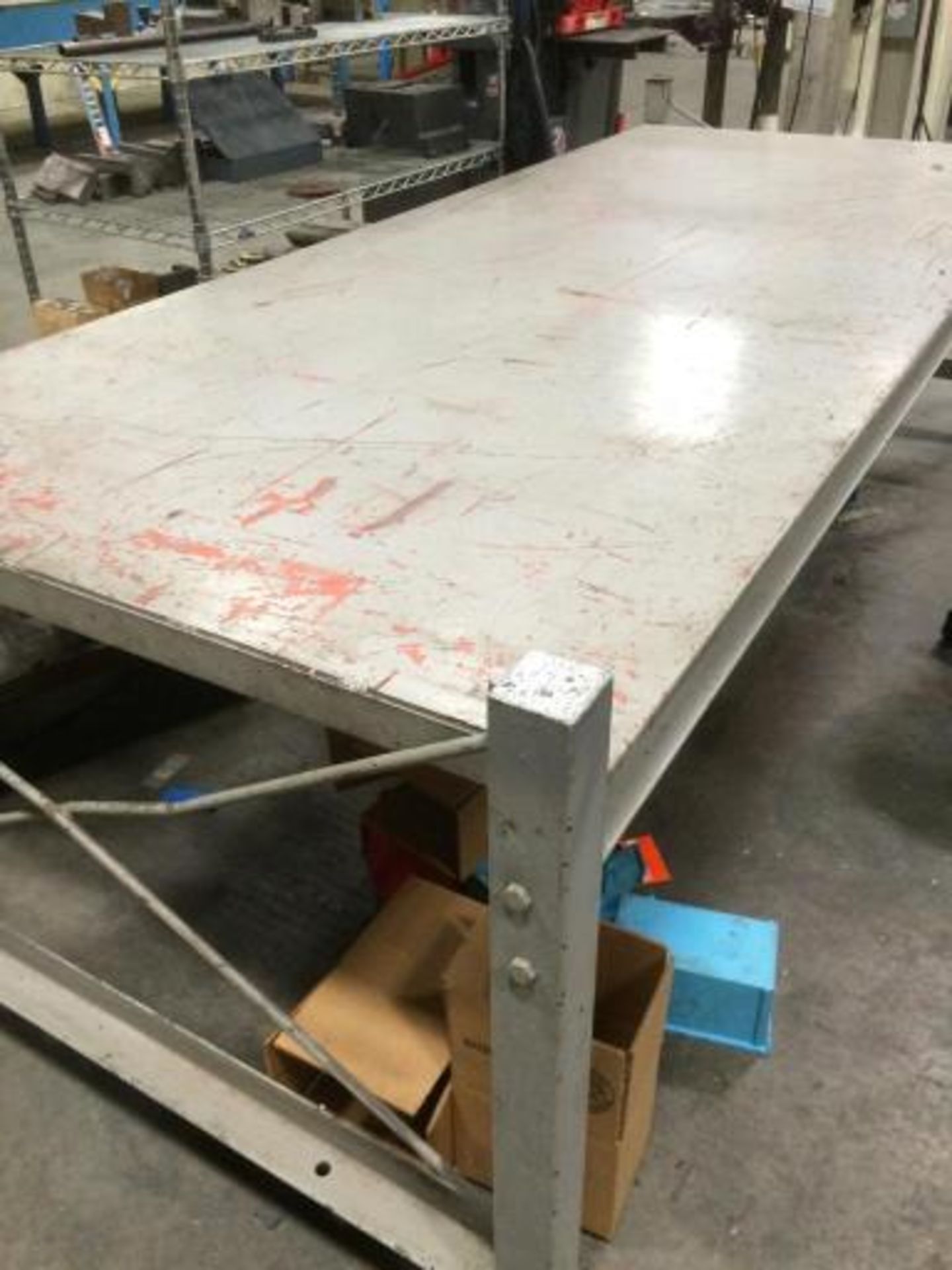 All steel and welded shop table with heavy duty casters. Measures 10' x 4' and bed stands 24"