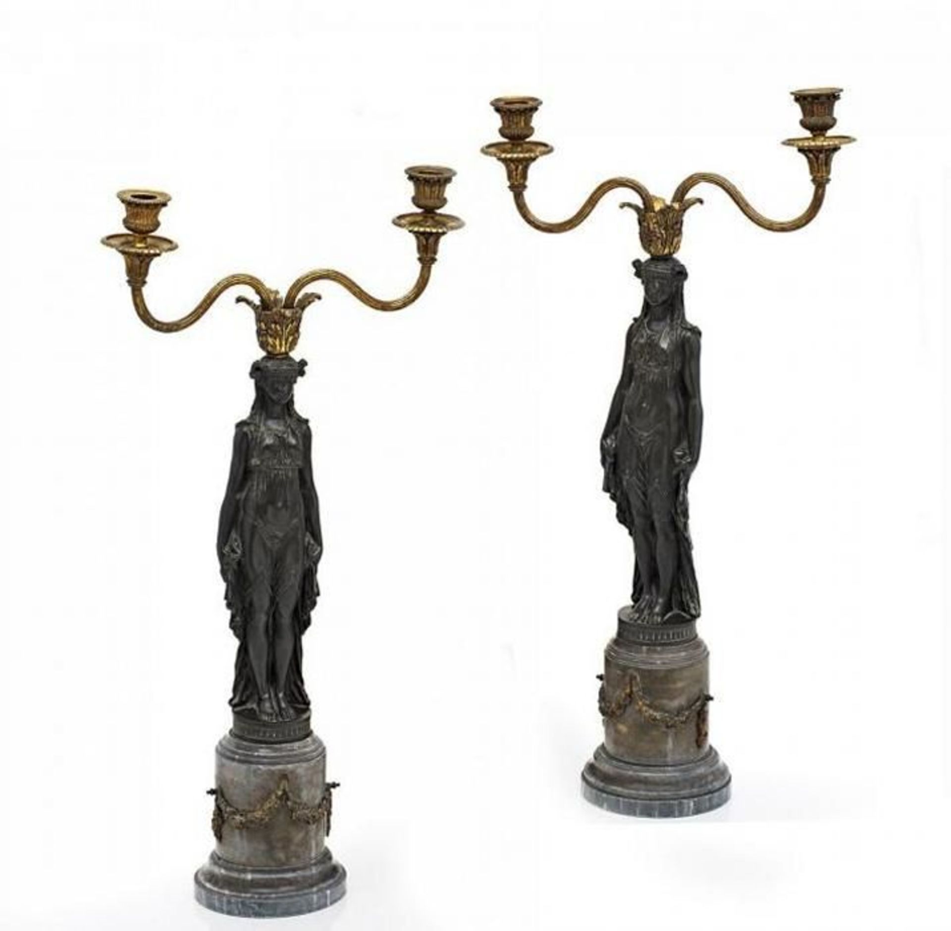 Pair of candelsticks Aux Victoires.  France. 2nd half of 19th Century. Inscribed Clodion.   Grey