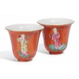 PAIR OF SMALL CUPS. PORCELAIN.Qing Dynasty, Daoguang period (1821-50).On coral red fond two of the