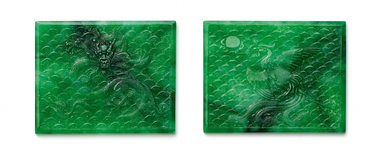 PAIR OF PANELS WITH DRAGON AND PHOENIX. JADE.China, Qing Dynasty.Emerald green jade with moss