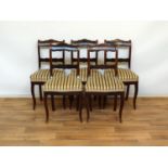 set van 5 mahonie stoelen
set van 5 mahonie stoelen met gecontourneerde regel in de rug, bekleed met