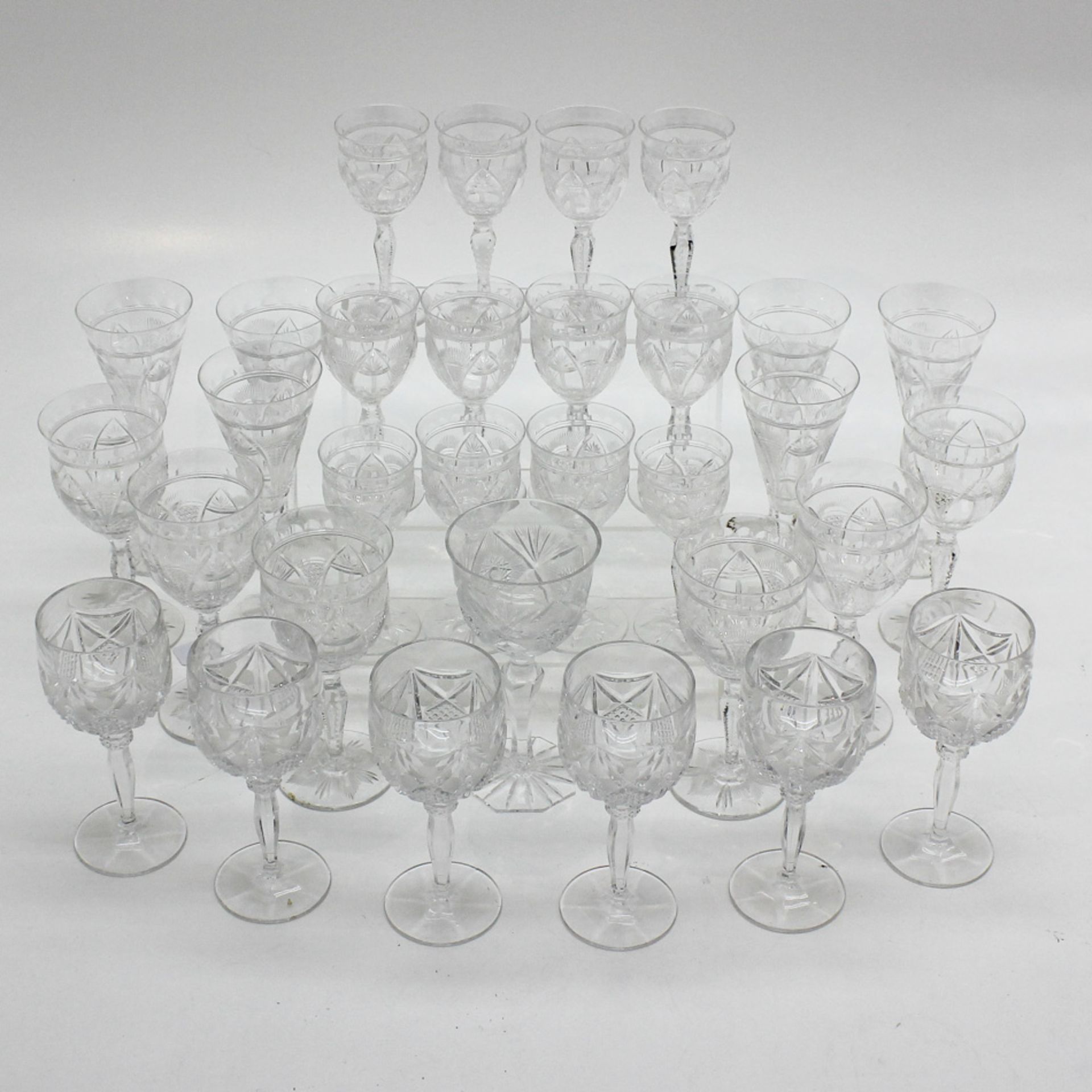 Lot of 31 Stemmed Fine Cut Crystal Glasses Largest measures 20 cm tall.