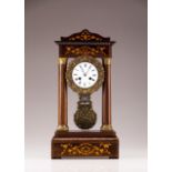 A 19th century French table clock  Rosewood veneered wood with marquetry decoration and brass