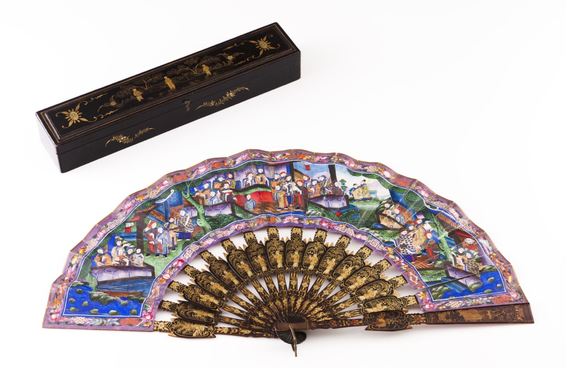 A 19th century Chinese fan  Lacquered wood structure  Gilt decoration with oriental landscapes