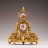 A French late 19th, early 20th century table clock  Gilt bronze d'art  French porcelain plaques