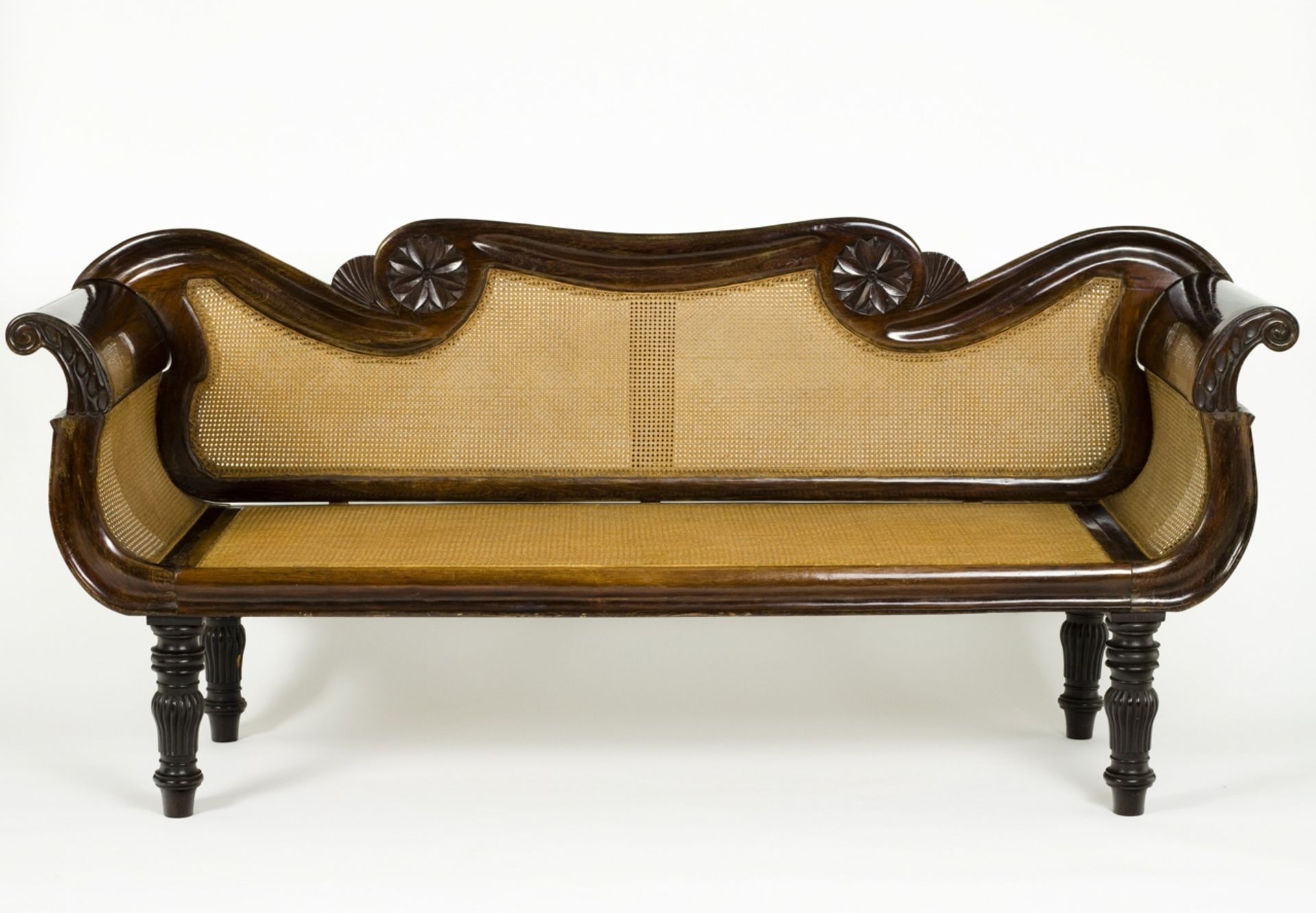 A romantic rosewood settee  Caned sides, back and seat.    214x68x97cm