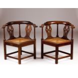 A pair of D.José/D.Maria walnut corner chairs  Scalloped backs, turned strechers  Canned seats