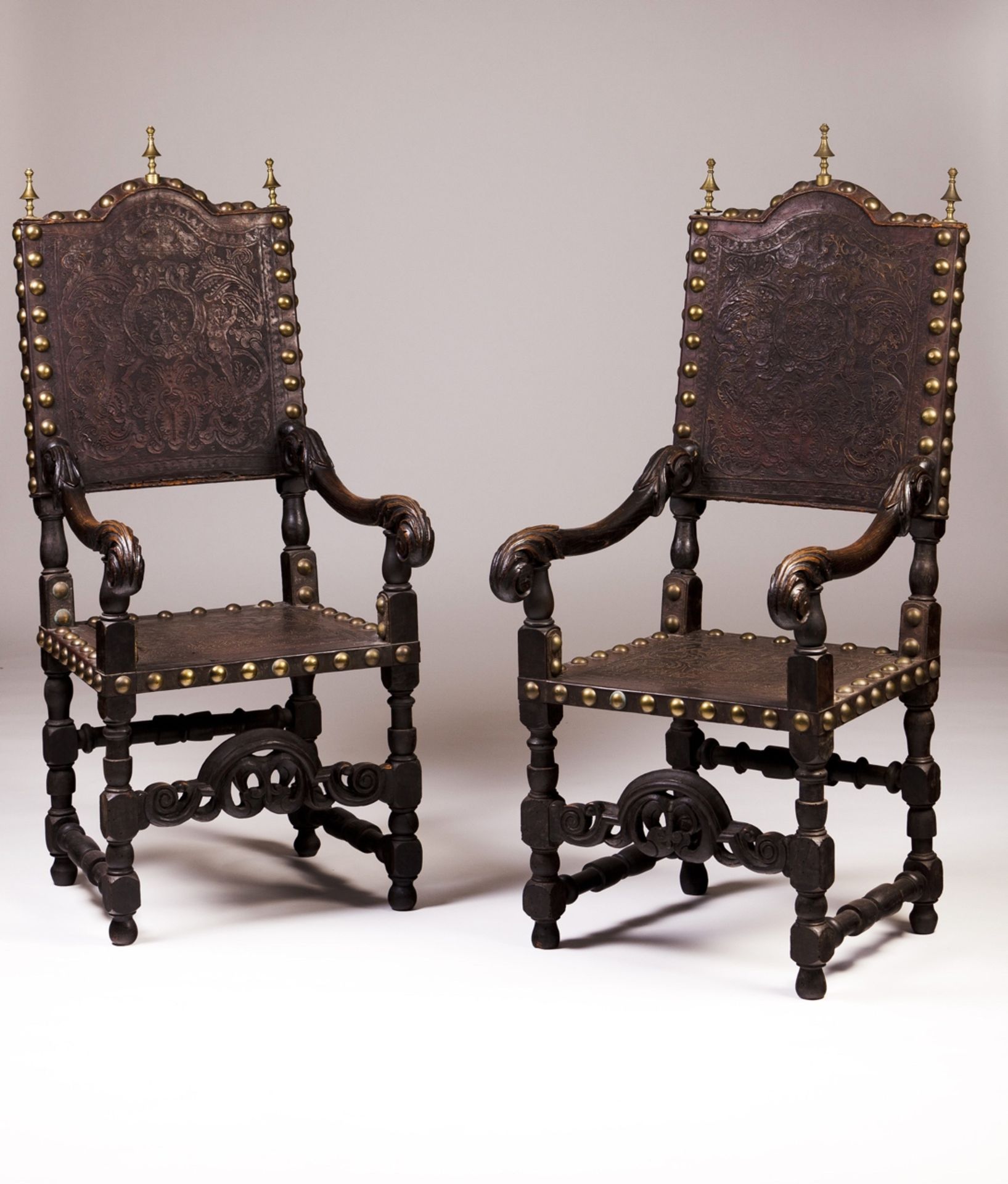 A pair of late 18th, early 19th century Portuguese armchairs  Ebonized wood  Engraved leather