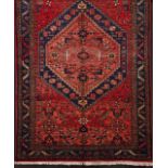 A Zanjan Persian carpet  Cotton and wool  Geometric decoration in blue, red and brown    225x135 cm