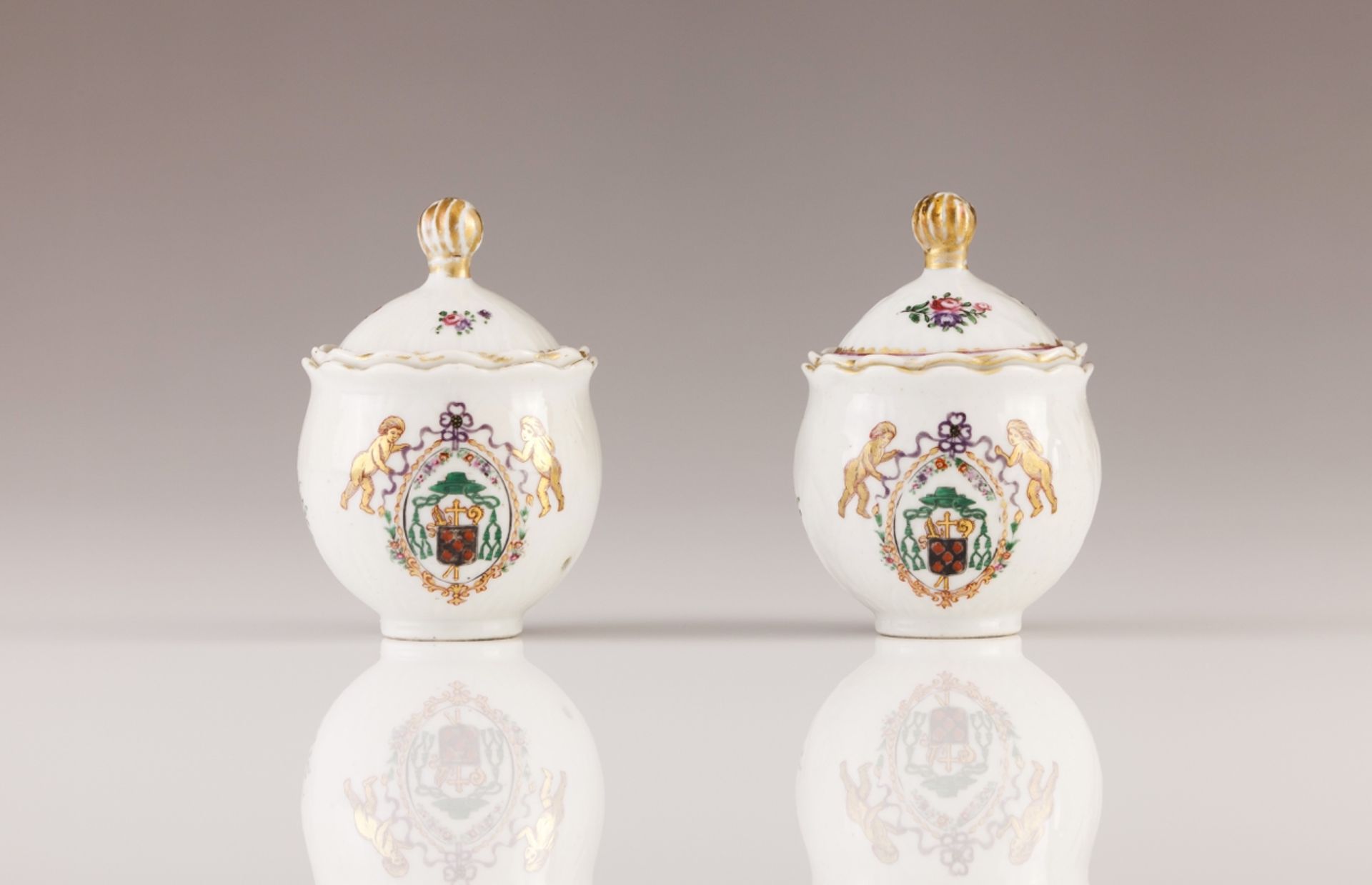 A par of Qianlong armorial sauce cellars  Chinese export porcelain  Polychrome Famille Rose and