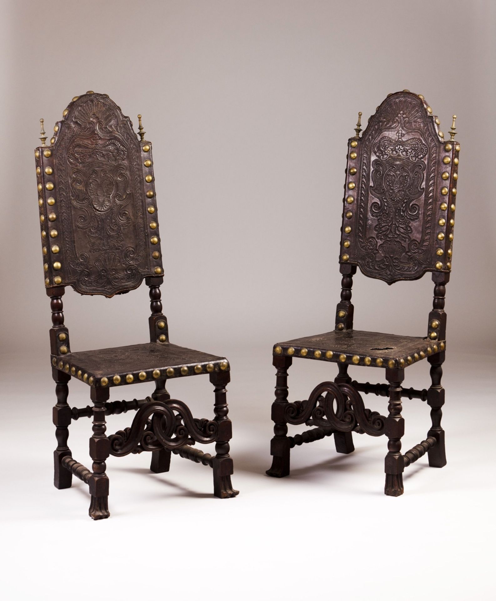 A pair of late 18th, early 19th century Portuguese armchairs  Ebonized wood  Engraved leather