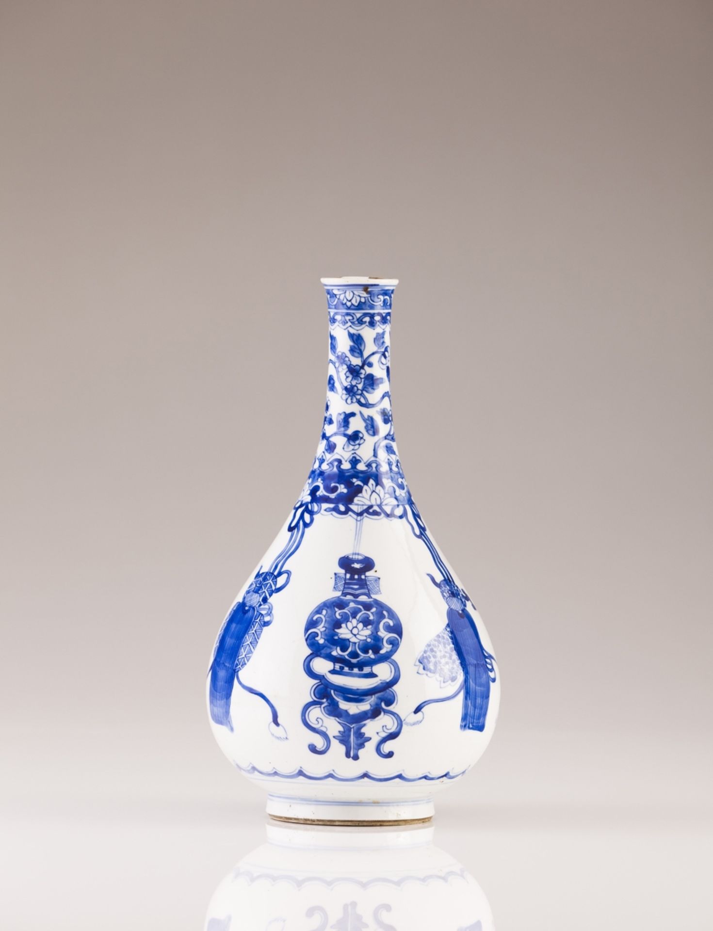 A Kangxi bottle  Chinese porcelain  Blue decoration depicting floral motifs and precious objects