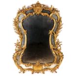 A 19th century mirror  Gilt wood and gesso  Decorated with shell and floral motifs  Europe, 19th