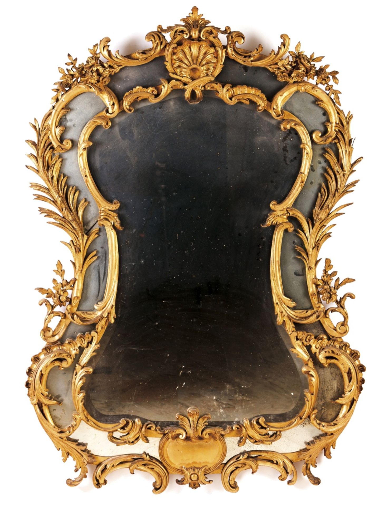 A 19th century mirror  Gilt wood and gesso  Decorated with shell and floral motifs  Europe, 19th