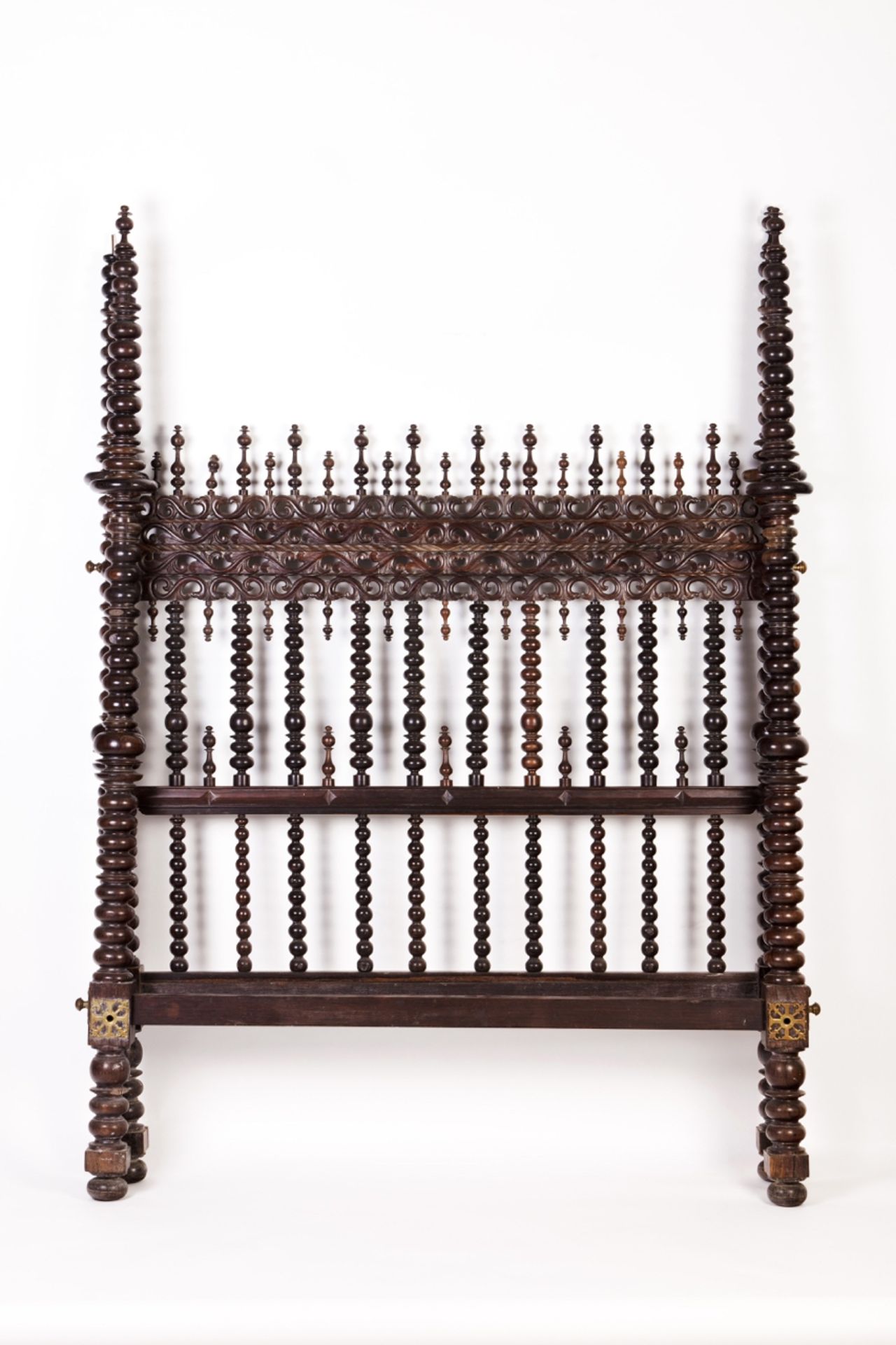 A 19th century Portuguese rosewood "bilros" bed  Carved and turned Rosewood  Pierced brass mounts  P