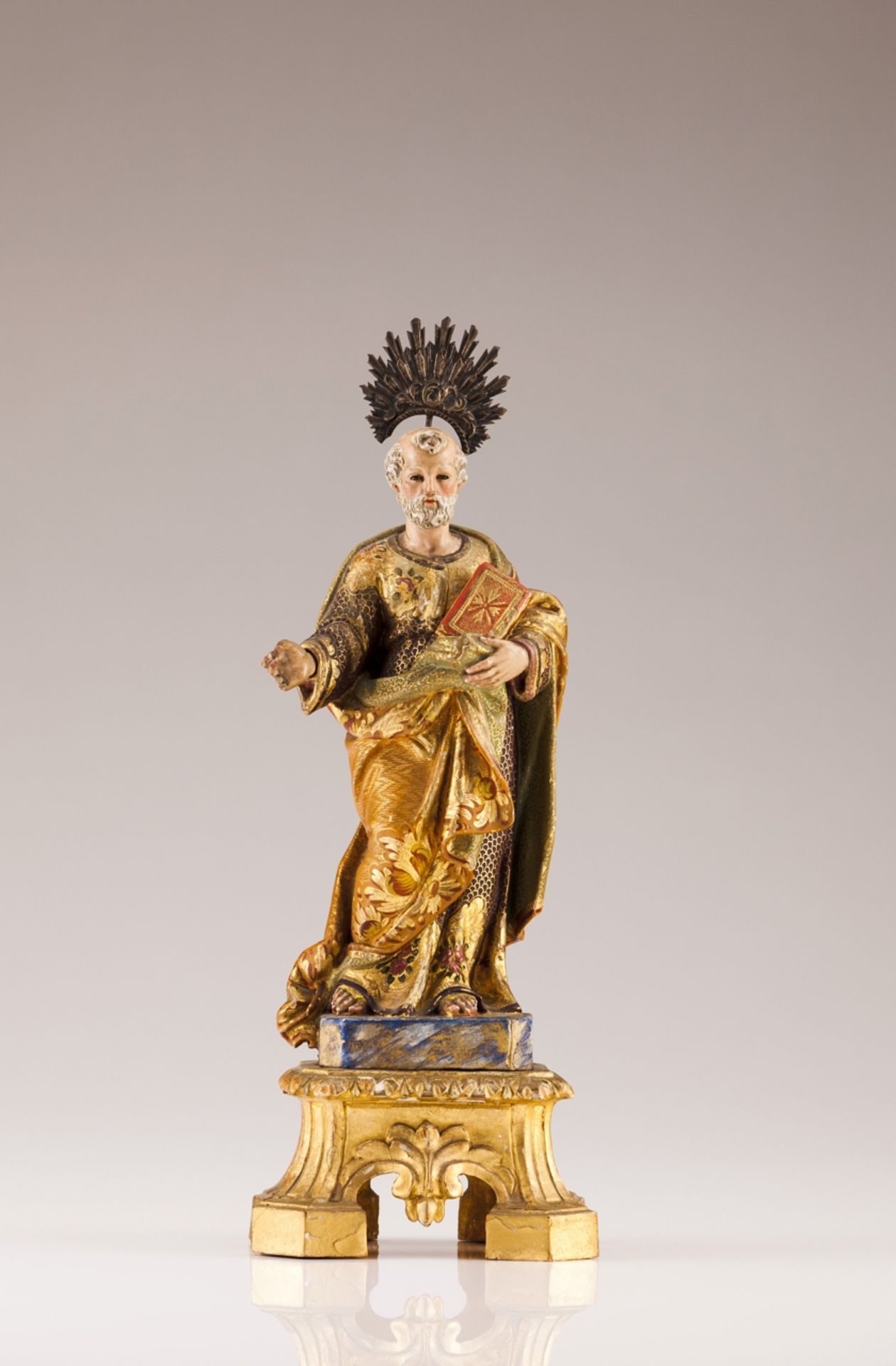 A 18th century Portuguese sculpture of Evangelist  Carved, gilt and polychrome wood   Gilt base