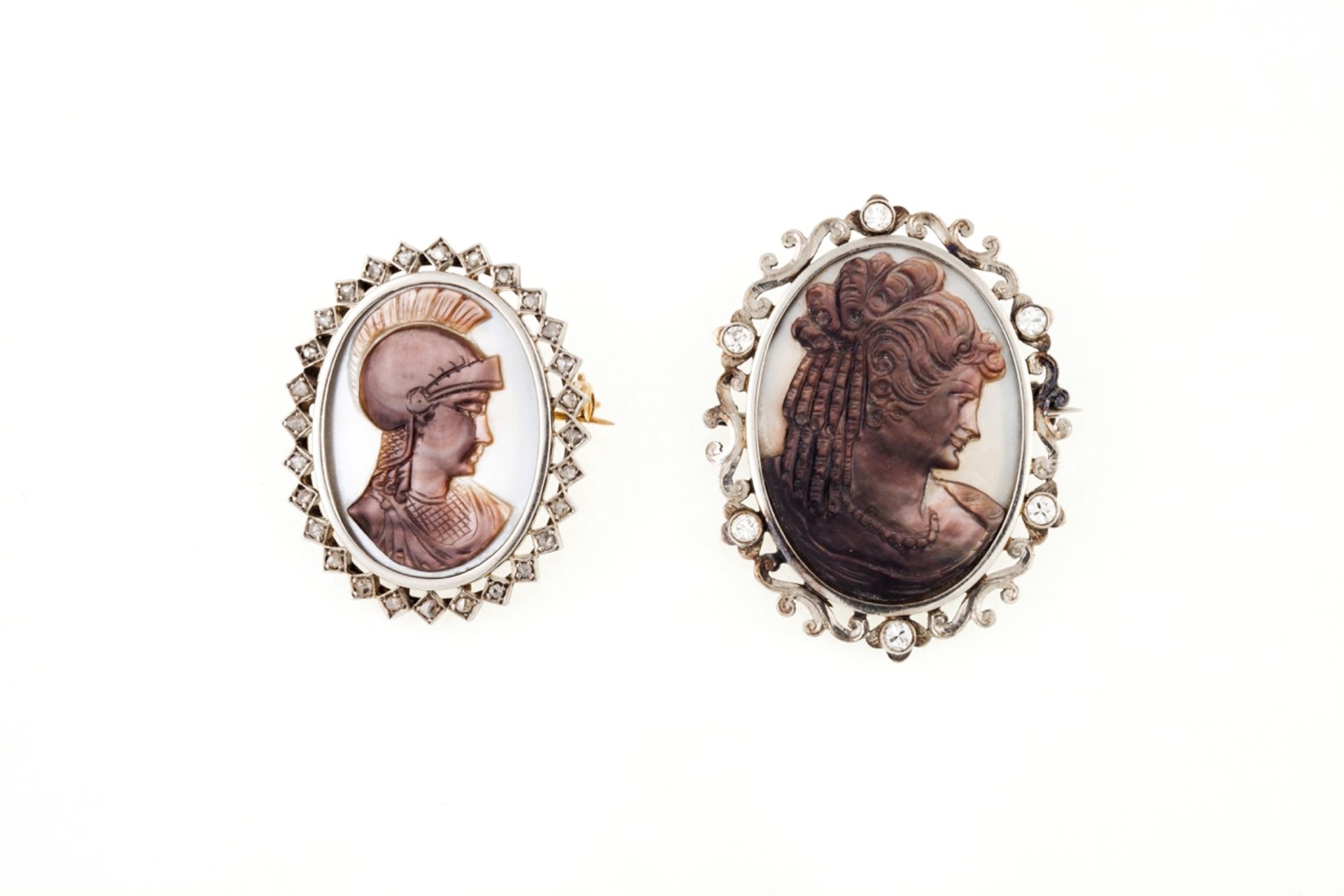 Two diamond and cameo brooches  Both set in gold with mother-of-pearl cameos, frames set with rose c