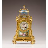 A 19th century French gilt bronze table clock  Porcelain-mounted  France, 19th century  (mechanism i