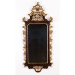 A wall mirror in the D.José manner  Carved, gilt and rosewood veneered   Portugal, 19th century    1