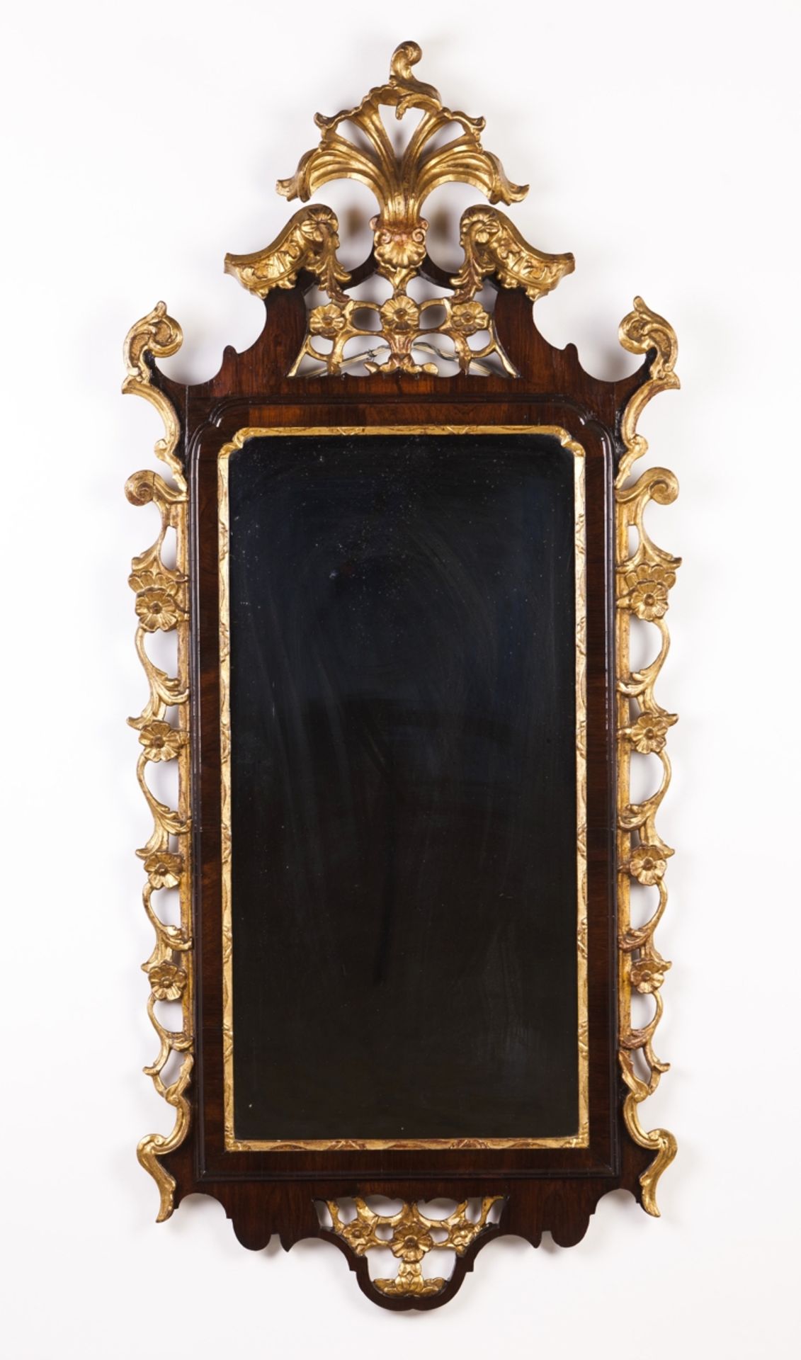 A wall mirror in the D.José manner  Carved, gilt and rosewood veneered   Portugal, 19th century    1