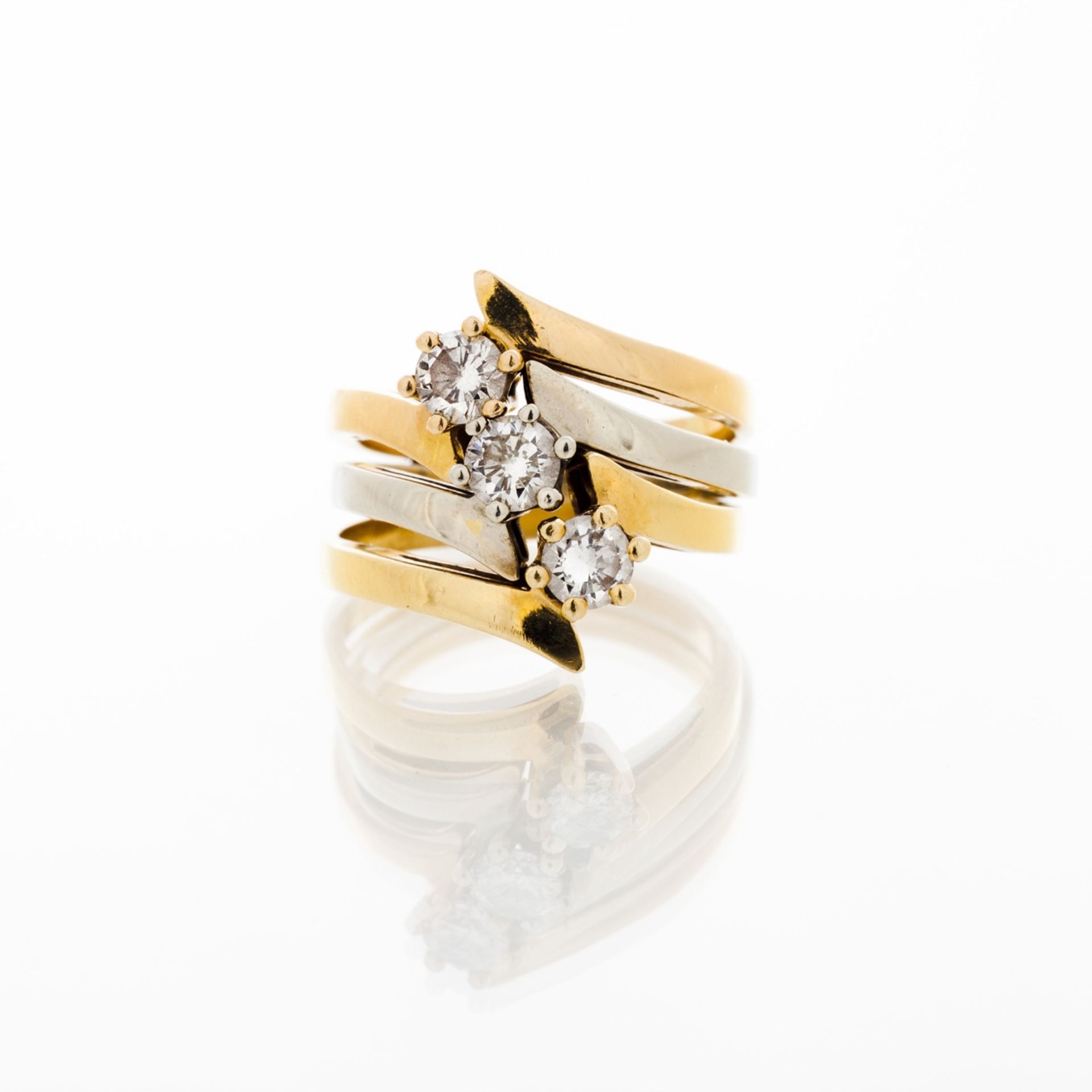 Set of three diamond rings  Set in three-toned gold with three brilliant cut diamonds (ca. 0,75ct)