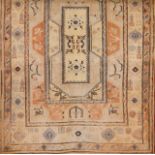 A Persian Sarooq cotton and wool carpet  Of floral and geometric design in blue, beige and coral