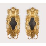 A pair of two-light wall lights  Carved and gilt wood with mirrors    63x29 cm