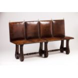 A 19th century Portuguese bench   Leather seat and back  Chestnut feet with carved decoration