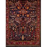 A Ilam Persian carpet  Cotton and wool  Geometric decoration in blue, red and brown    215x130 cm