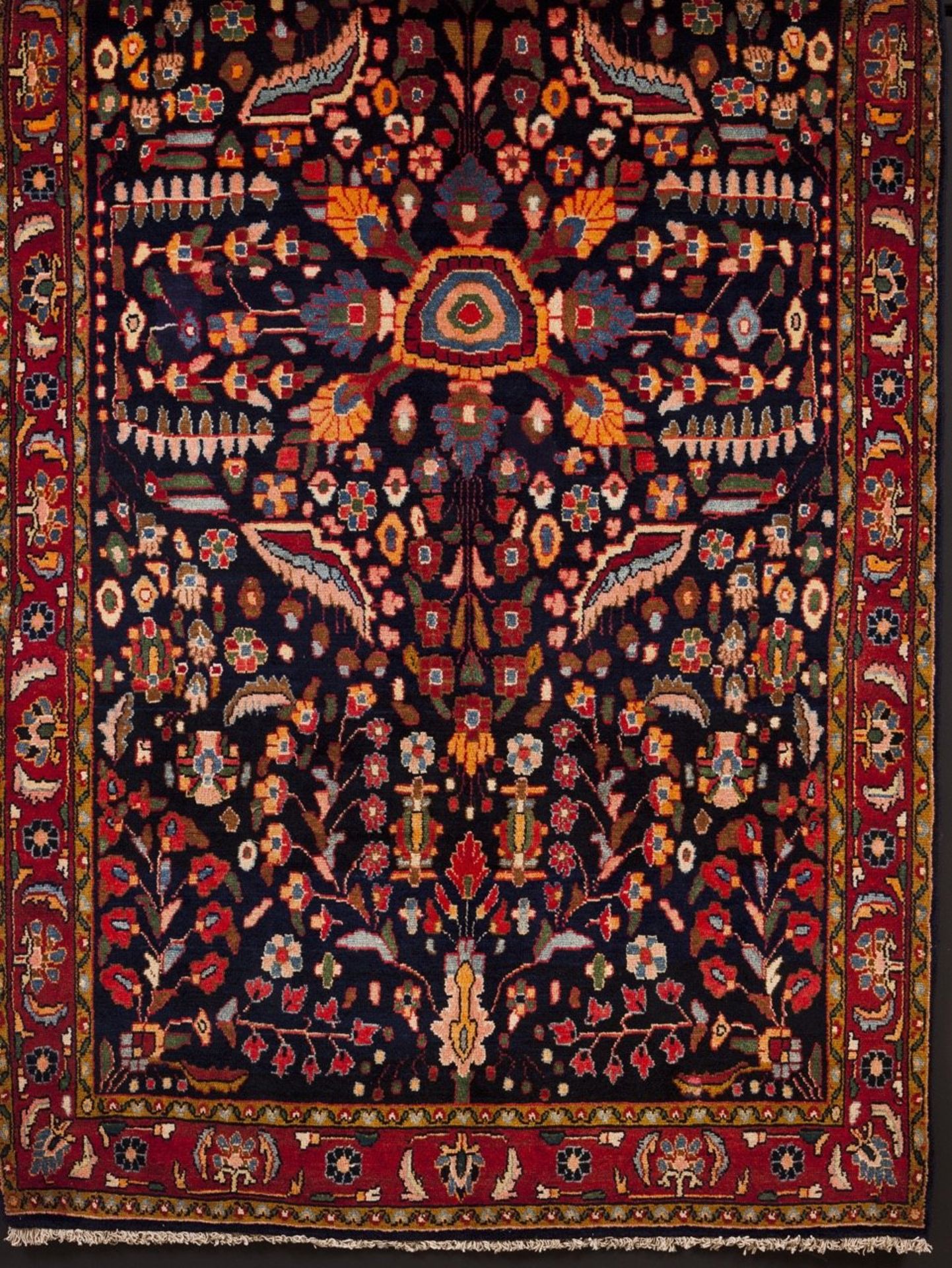 A Ilam Persian carpet  Cotton and wool  Geometric decoration in blue, red and brown    215x130 cm