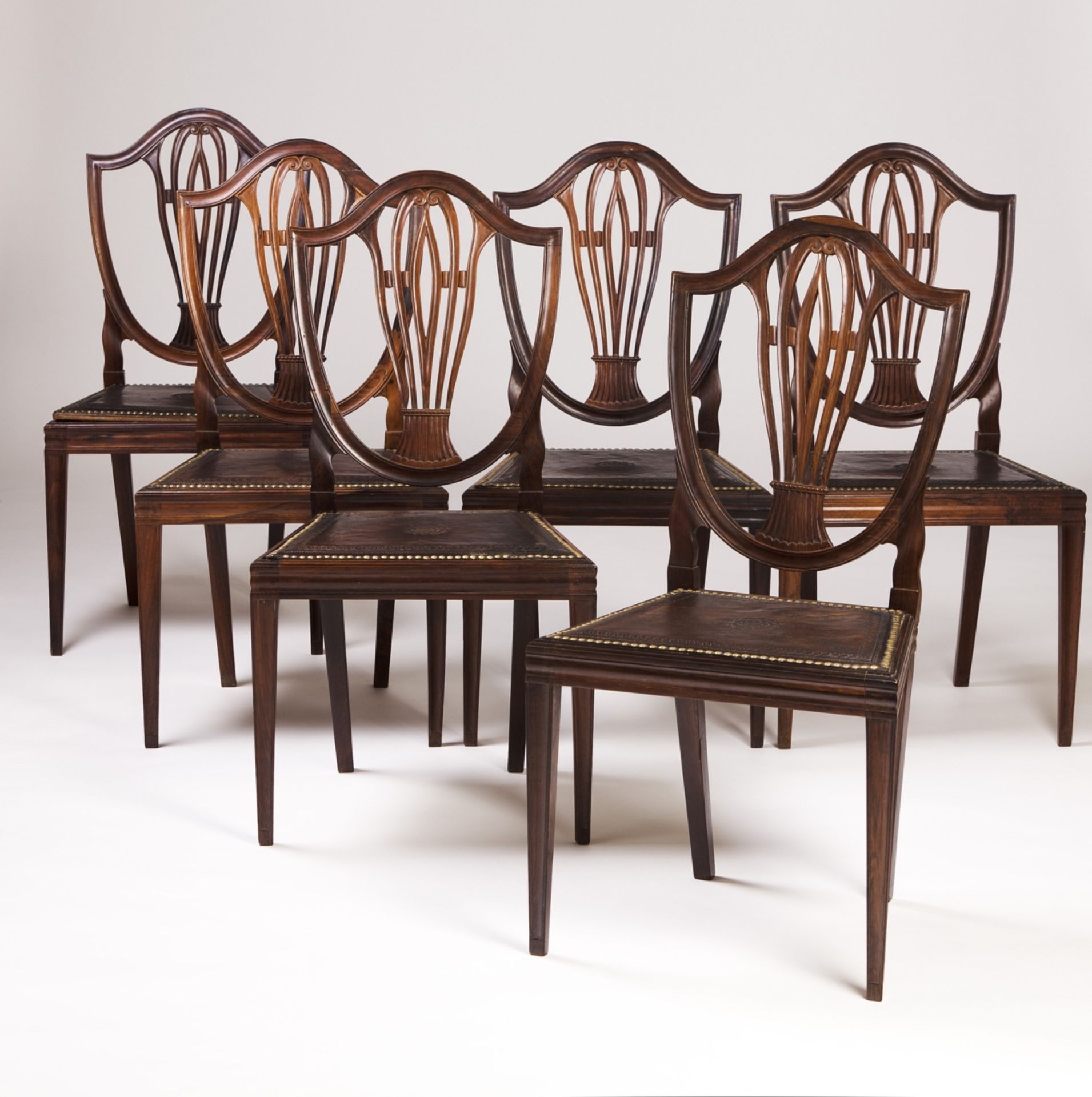 A set of six Rosewood D.Maria (1777-1816) chairs  Pierced and scalloped backs and engraved leather s