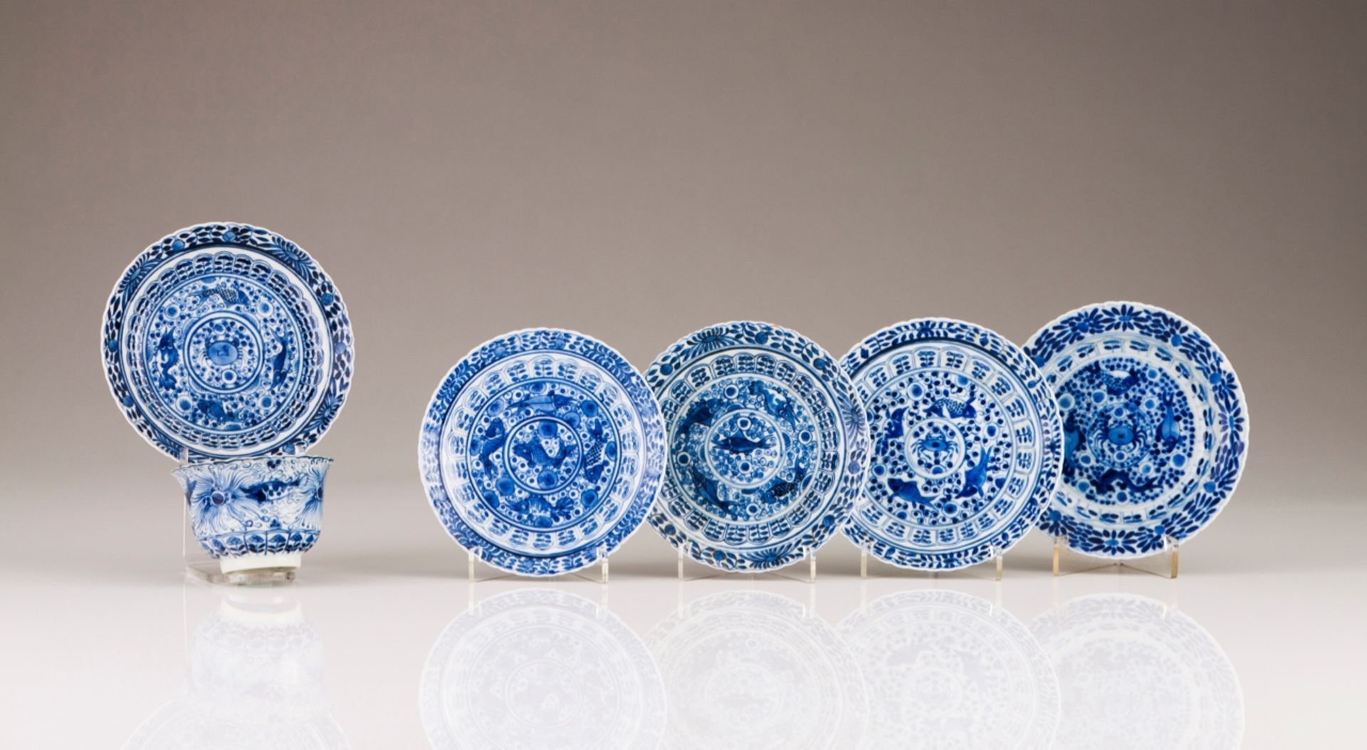 A Kangxi cup and saucer
Chinese porcelain
Blue decoration depicting floral motifs, fishes and crabs