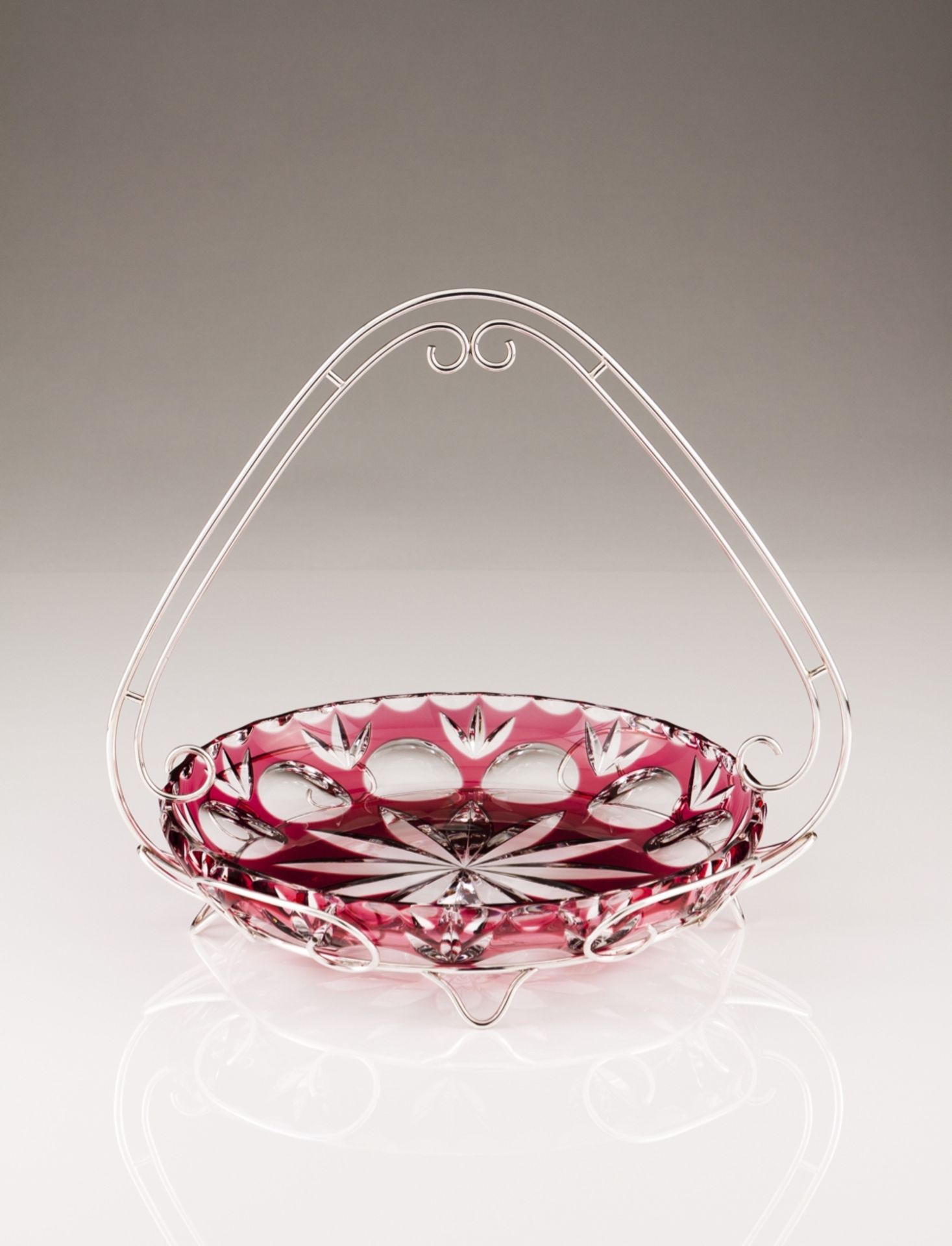 A crystal and Portuguese silver fruit bowl
Red and colorless overlay crystal, silver mount and