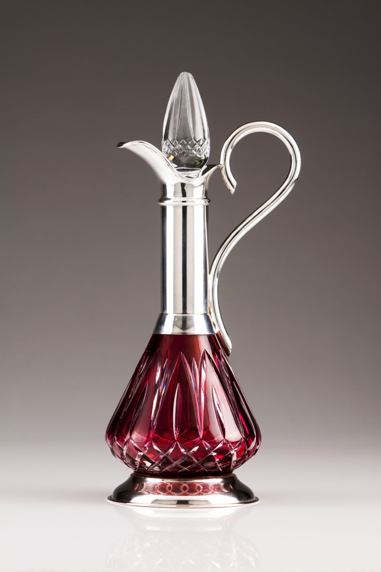 A silver-mounted crystal jar
Two-toned overlay cut-glass, silver neck, foot and handle
Porto assay