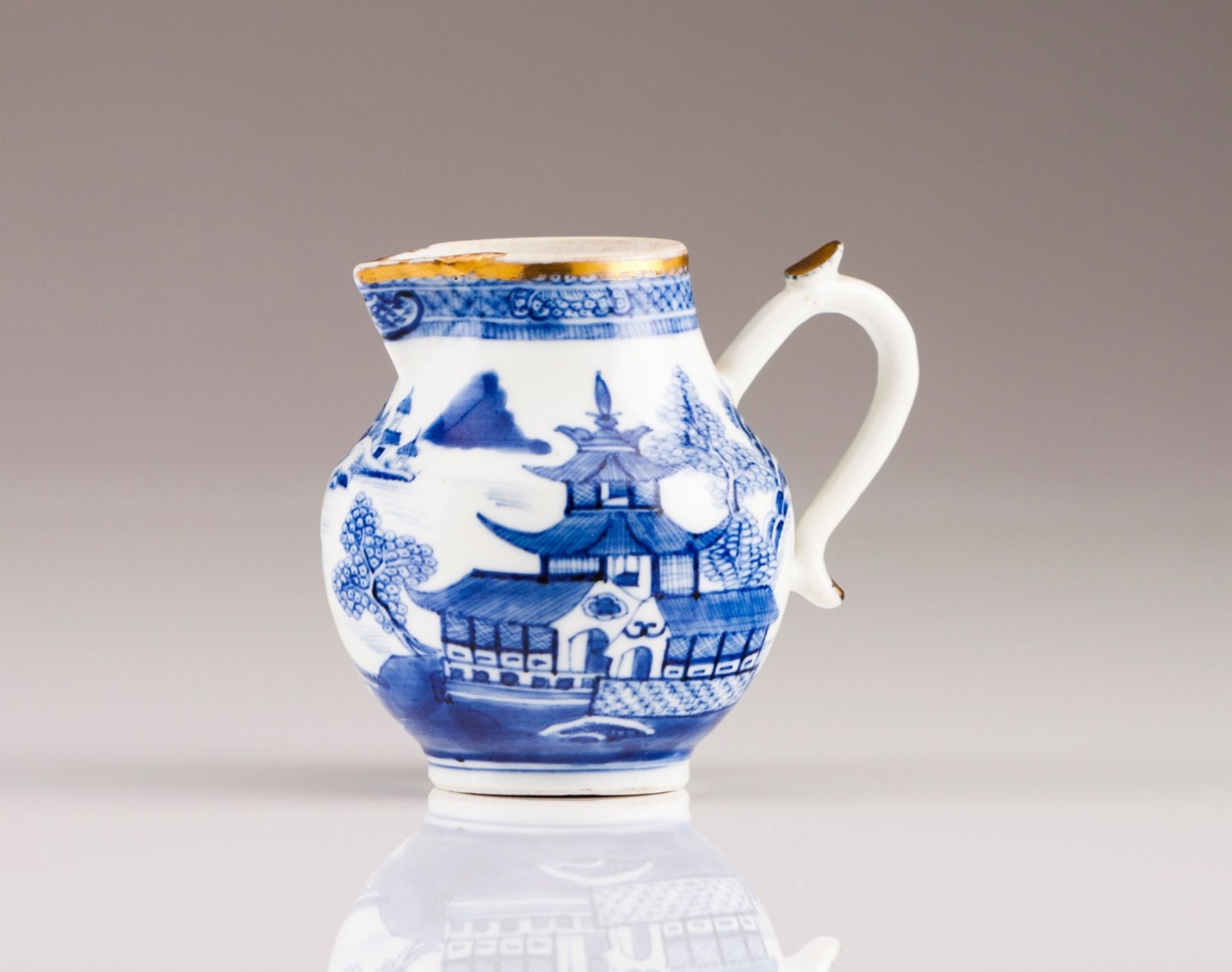 A Qianlong milk jug
Chinese export porcelain
Blue decoration depicting riverscapes
Qianlong