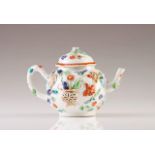 A small tea pot
Chinese export porcelain
Relief and polychrome decoration in the Meissen manner