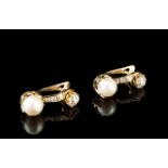 A pair of diamond and pearl earrings
Set in gold with two cultured pearls, one rose cut diamond