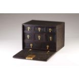 An 18th century Cingalo-Portuguese cabinet
Ebony
Profuse carved decoration
The fall-front opens to