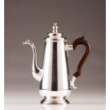 A Portuguese silver coffee pot in the D.José style
Plain body, turned cover finial, and spout