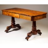 A Regency center table
Rosewood veneered wood
Two drawers simulating four
On two carved columns