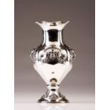 A Portuguese silver vase
Of baluster form, relief decoration in the baroque manner, gilt interior