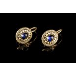 A pair of earrings
Set in gold with cabochon sapphires
Portugal, 20th century
(wear signs)