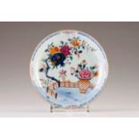A saucer
Chinese export porcelain
Polychrome and gilt decoration with flowers and other floral