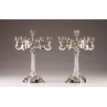 A pair of Portuguese silver five-light candelabra
Profuse relief and chiseled decoration in the