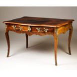 A Louis XV style bureau-plat
Rosewood veneered wood
Two drawers simulating four and brass mounts