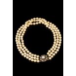 A cultured pearl choker
Three rows of fine golden cultured pearls, gold clasp set with cultured